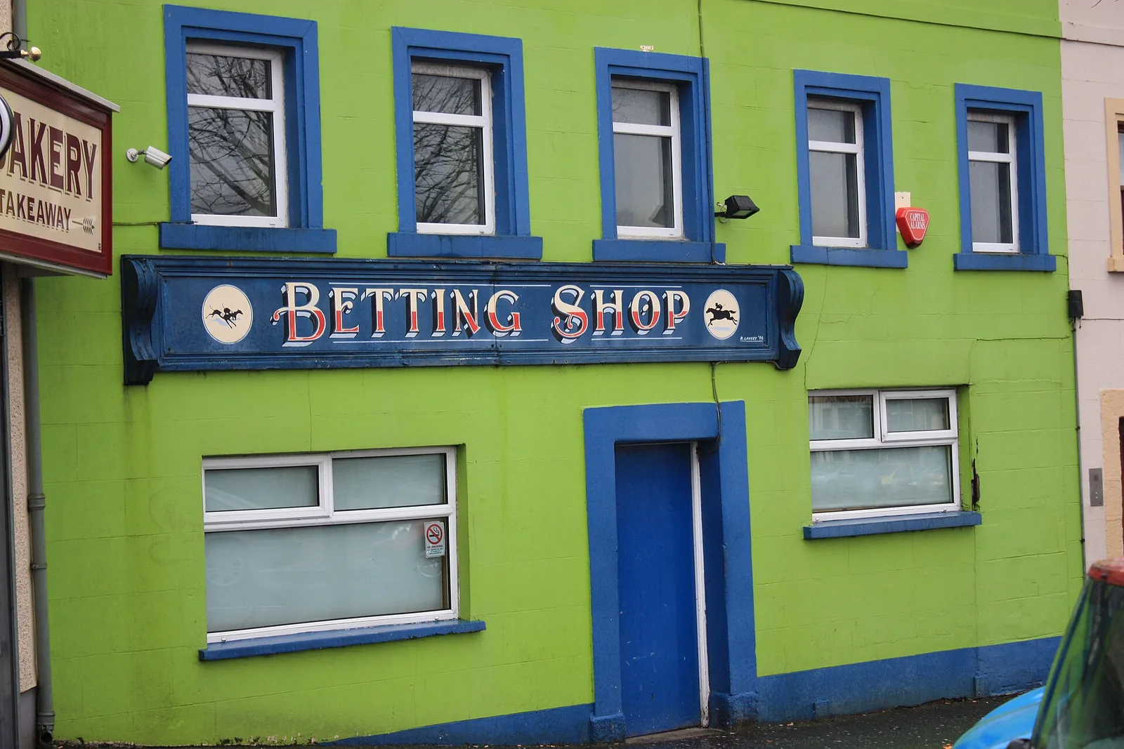 Vedonlyöntiliike Betting Shop -kyltin kanssa